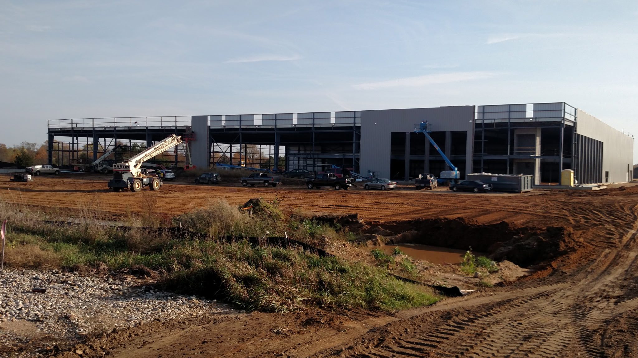 Construction site with building framework and machinery.